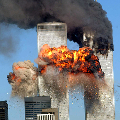 An image of the Twin Towers in flames